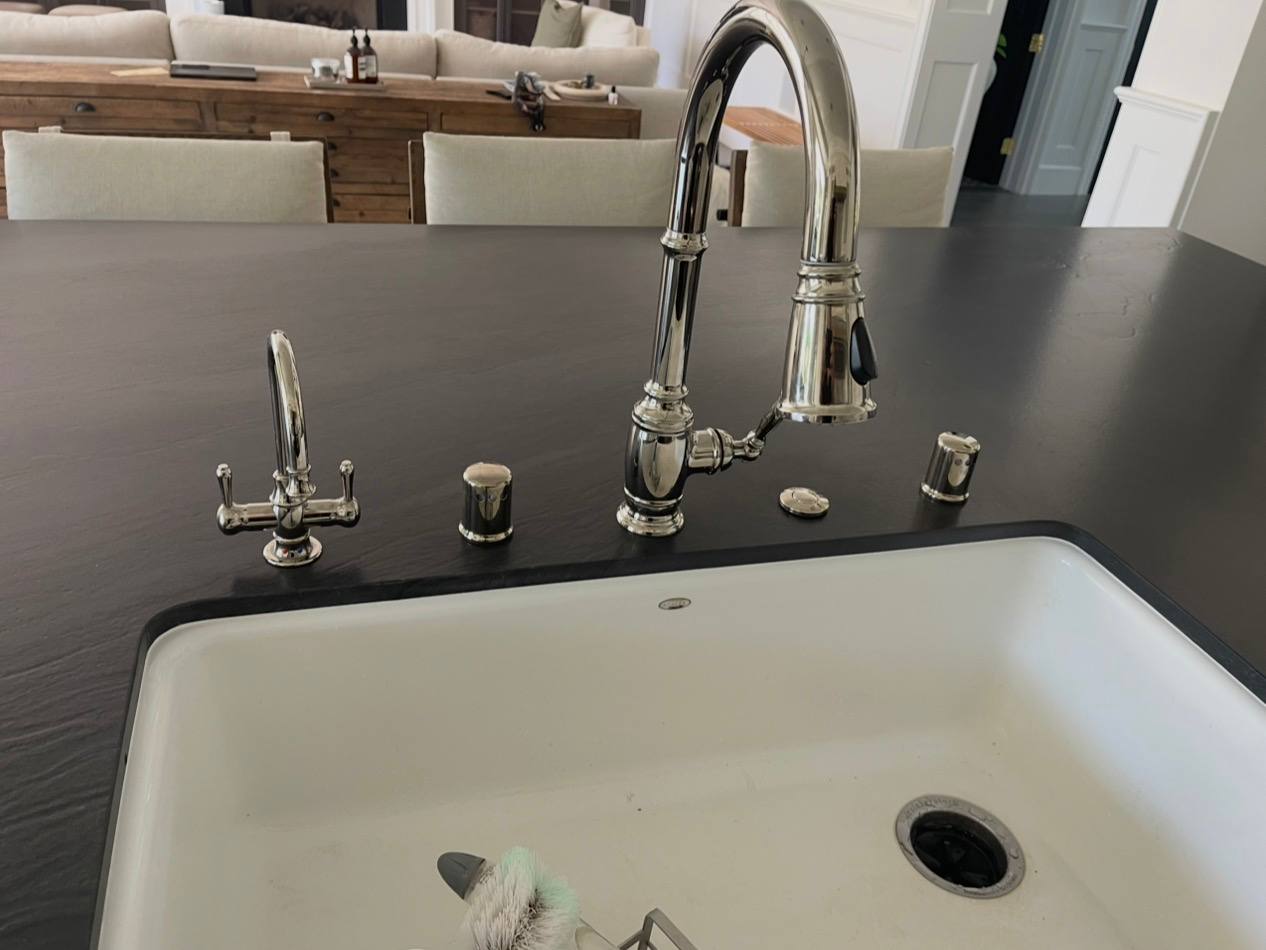 Kitchen sink with a high-arc faucet